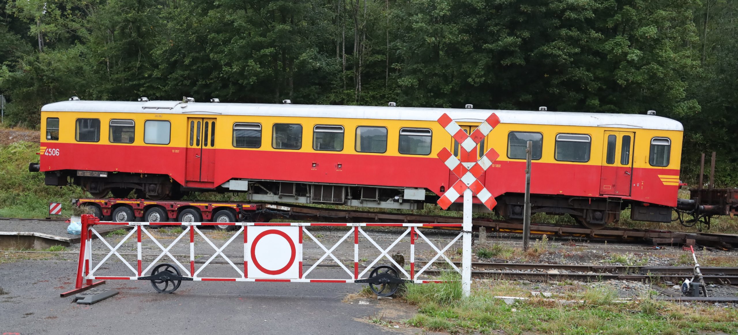 a passenger train that is sitting on a railroad track